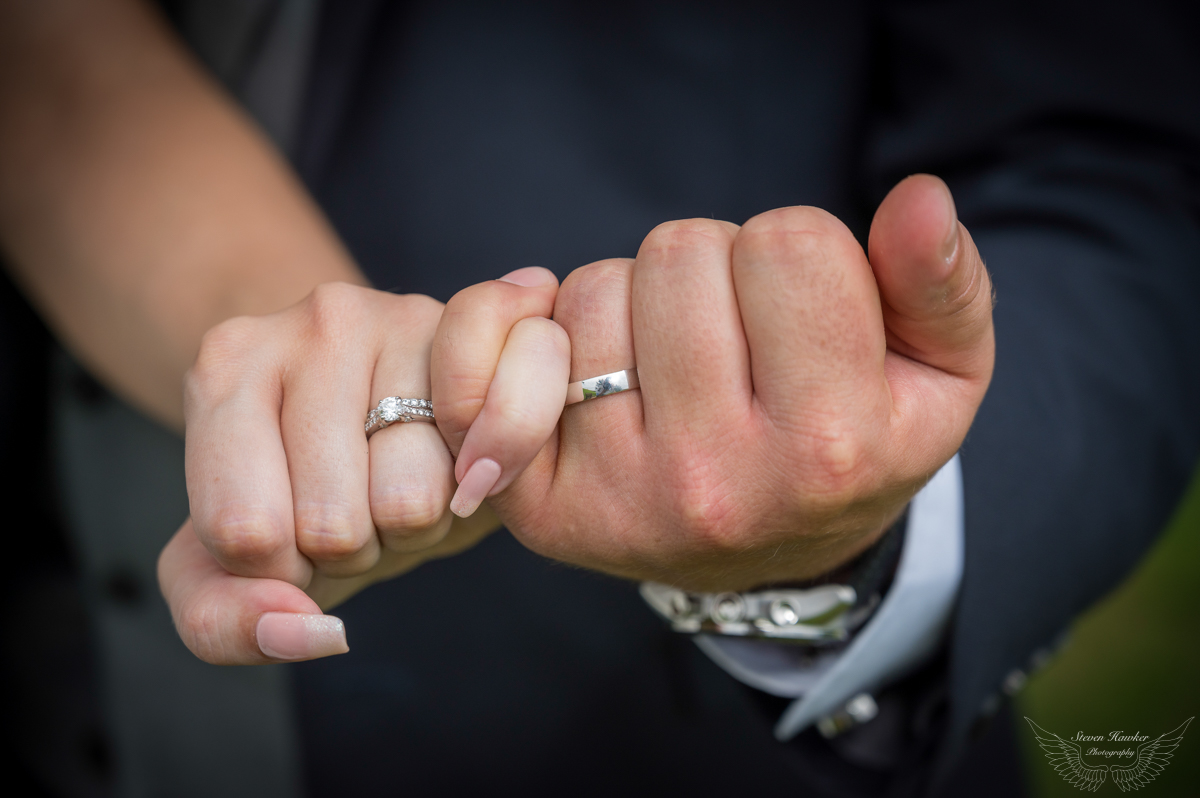 Bride & Groom showing off wedding rings