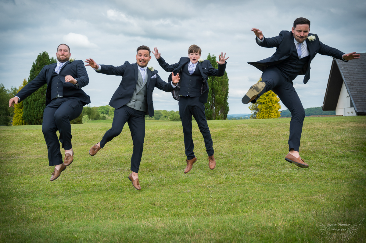 Groom and best men jump for joy at Tredegar Park Golf Club