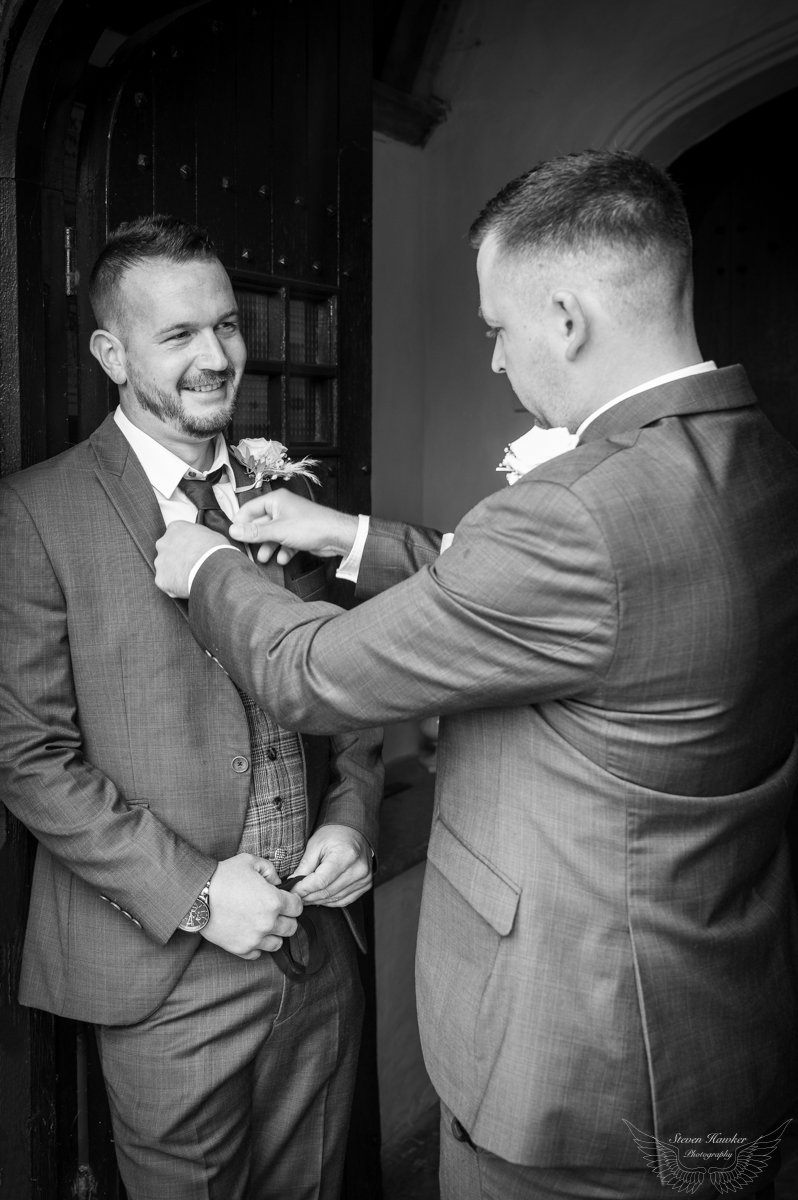 Groom and best man waiting at the church